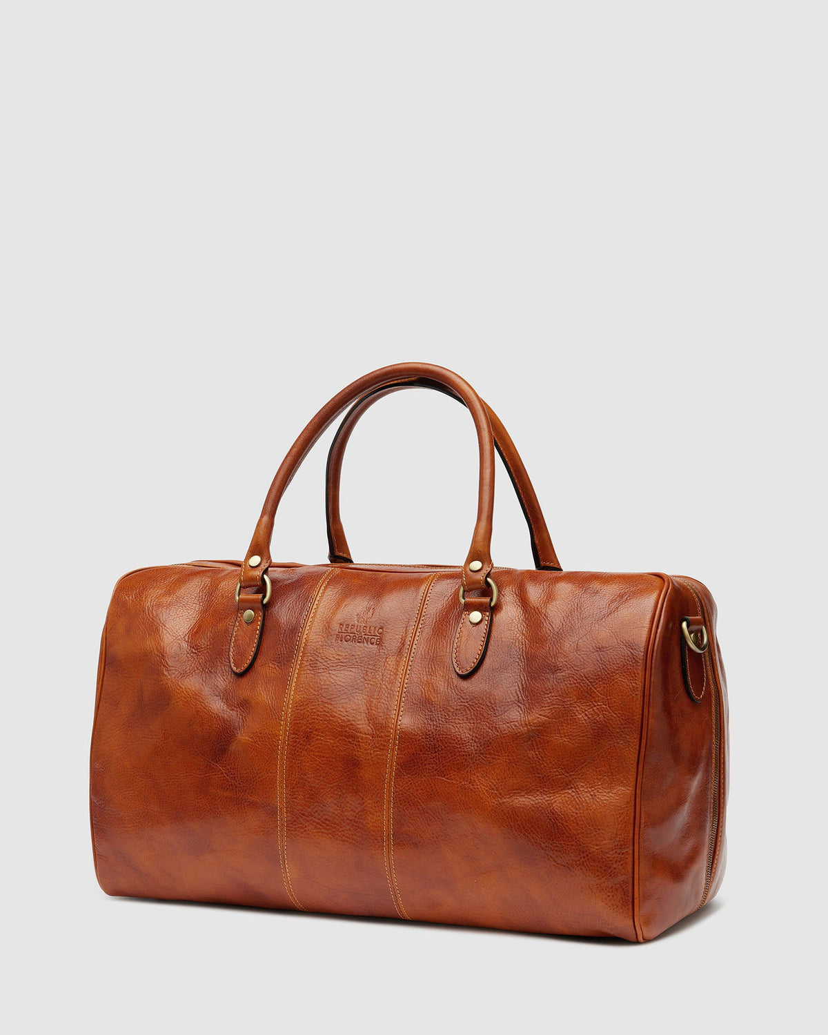 Tan leather duffle bag top